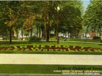 Postcard - Floral Design, "In Detroit, Life is Worth Living," Grand Circus Park, Detroit, Mich.