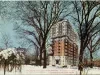 Postcard - Hotel Tuller and beautiful Grand Circus Park, Detroit, Mich. A cosy home on a winter's eve. Center of business and fireproof. $1.50 per day and upwards for room with bath.