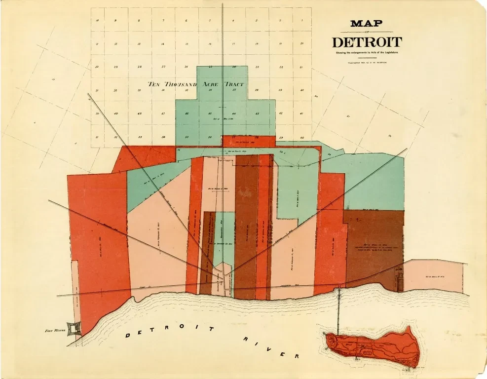 Colored historical map of Detroit, displaying districts in various shades of red, orange, and blue.